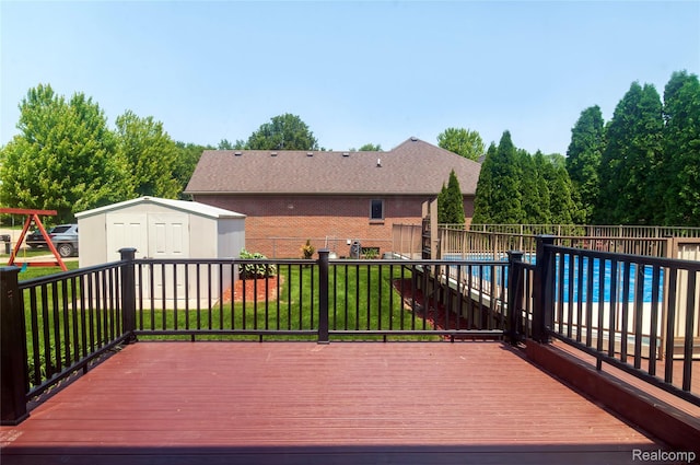 28475 Tiffin Dr, Chesterfield, MI 48047 - wooden deck featuring a storage unit and a fenced backyard