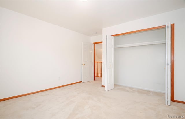 28475 Tiffin Dr, Chesterfield, MI 48047 - unfurnished bedroom featuring light carpet and a closet