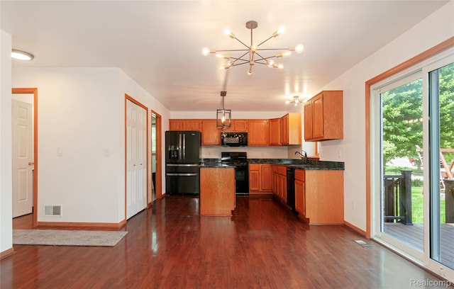 28475 Tiffin Dr, Chesterfield, MI 48047 - kitchen featuring black appliances, dark wood finished floors, dark countertops, a chandelier, and decorative light fixtures