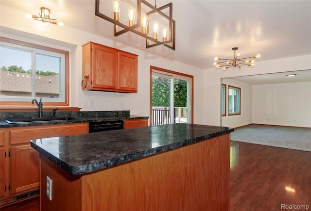 28475 Tiffin Dr, Chesterfield, MI 48047 - kitchen with a chandelier, dark wood-style flooring, dark countertops, open floor plan, and dishwasher