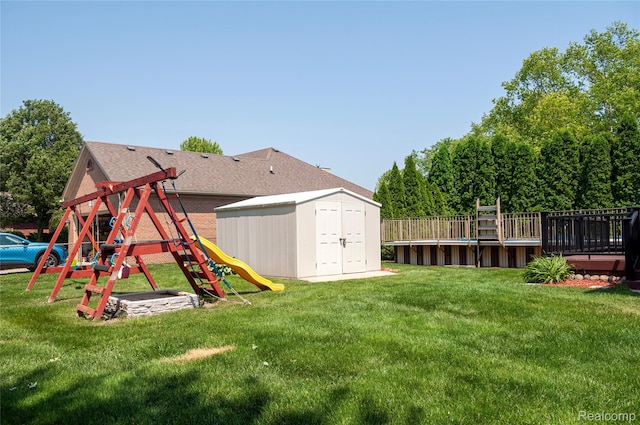 28475 Tiffin Dr, Chesterfield, MI 48047 - view of green lawn featuring a playground and a shed