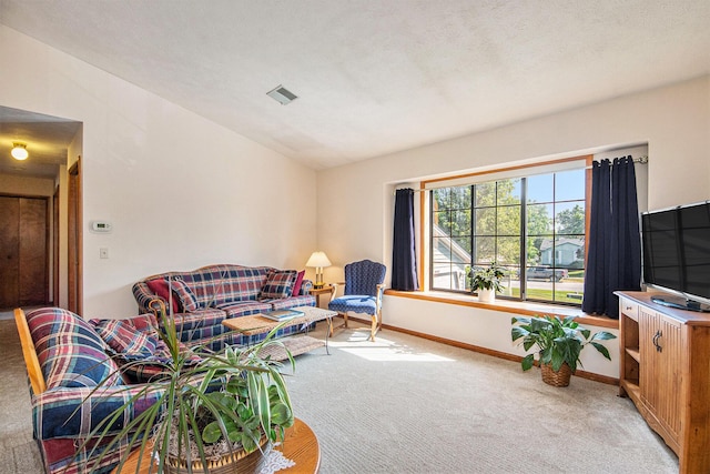 5049 Stauffer Ave SE, Grand Rapids, MI 49508 - living room featuring light colored carpet and lofted ceiling