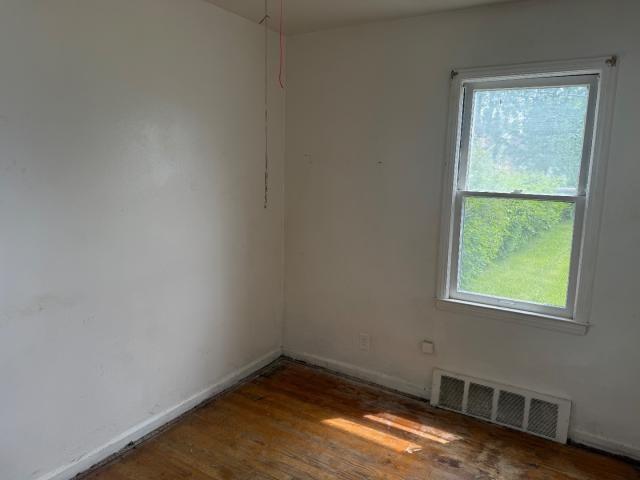 18908 Mackay St, Detroit, MI 48234 - spare room with healthy amount of natural light and wood finished floors