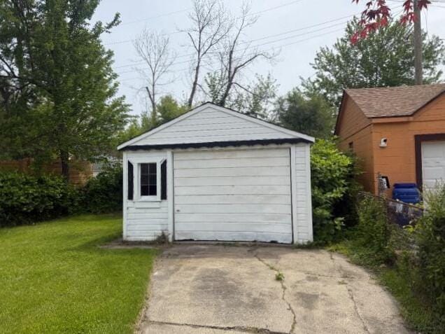 18908 Mackay St, Detroit, MI 48234 - detached garage with concrete driveway