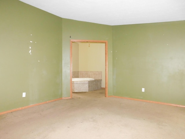1240 Abbey Ln, Mount Pleasant, MI 48858 - unfurnished bedroom featuring baseboards and ensuite bath