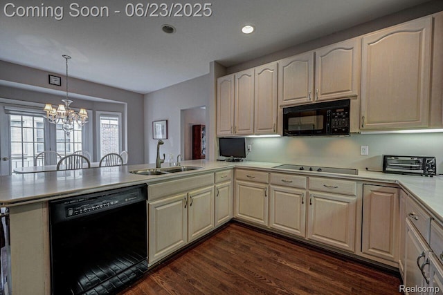 1081 Park Place Ct, Bloomfield Hills, MI 48302 - kitchen with black appliances, a peninsula, a chandelier, light countertops, and dark wood finished floors