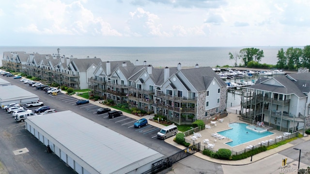 37510 Jefferson Unit 203, Harrison Township, MI 48045 - drone / aerial view of a pool area and a nearby body of water
