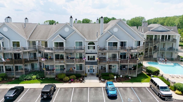 37510 Jefferson Unit 203, Harrison Township, MI 48045 - view of property featuring uncovered parking