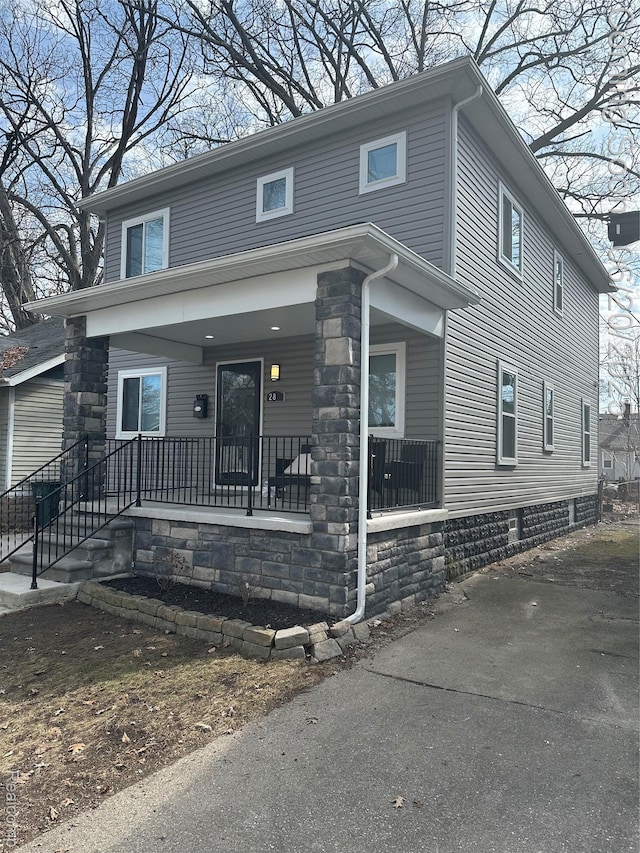 287 Fielding St, Ferndale, MI 48220 - view of front facade featuring a porch and stone siding