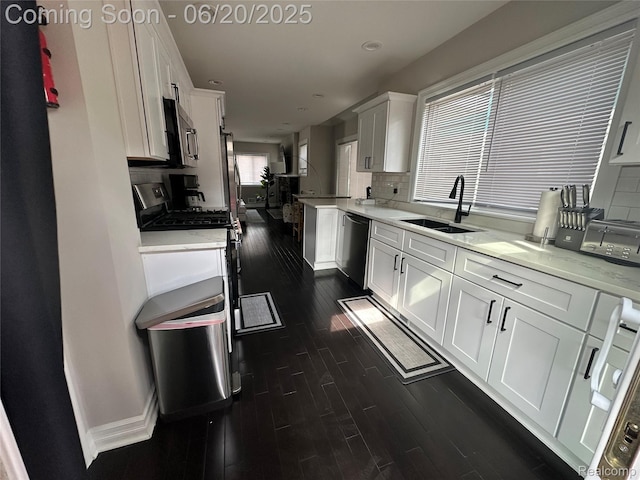 287 Fielding St, Ferndale, MI 48220 - kitchen featuring dark wood-type flooring, appliances with stainless steel finishes, white cabinetry, light countertops, and recessed lighting