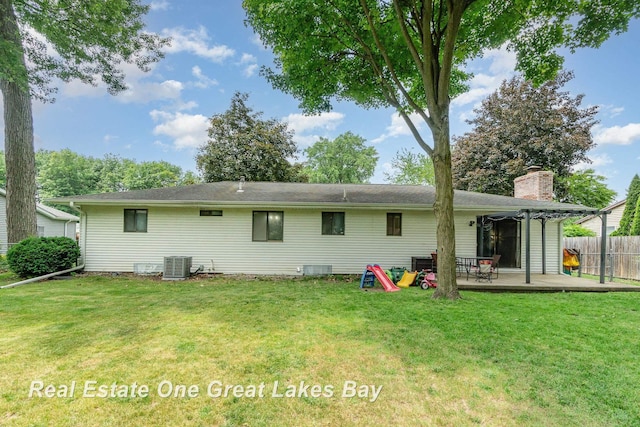 5178 Mangrove Dr, Saginaw, MI 48603 - rear view of house featuring a deck and a chimney
