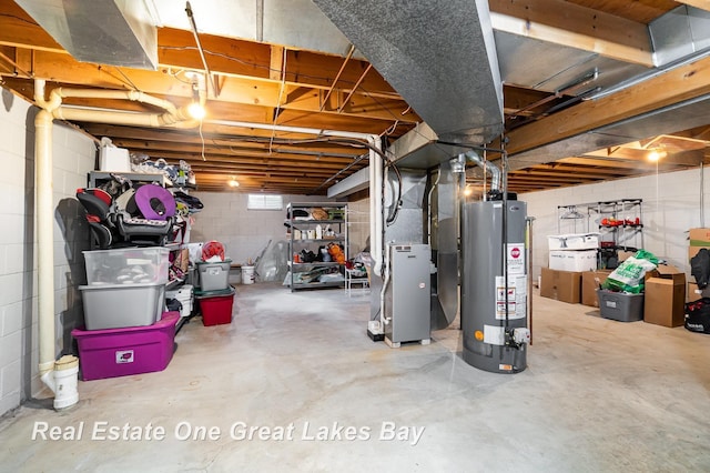 5178 Mangrove Dr, Saginaw, MI 48603 - unfinished below grade area with gas water heater, concrete block wall, and heating unit
