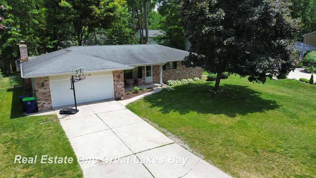 5178 Mangrove Dr, Saginaw, MI 48603 - ranch-style home featuring an attached garage, concrete driveway, brick siding, a front yard, and a chimney