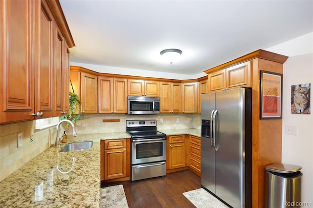 3851 Mapleleaf Rd, Waterford, MI 48328 - kitchen featuring stainless steel appliances, light stone counters, dark wood finished floors, and tasteful backsplash