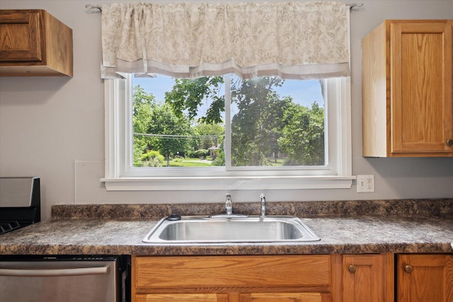 402 Ann Arbor St, Manchester, MI 48158 - kitchen featuring dishwasher, dark countertops, and brown cabinets