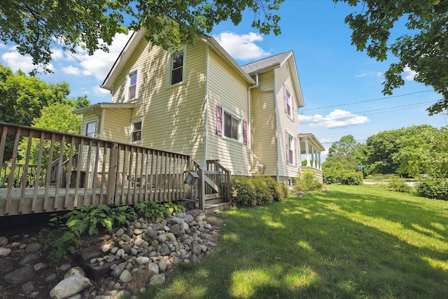 402 Ann Arbor St, Manchester, MI 48158 - view of side of home with a yard and a deck