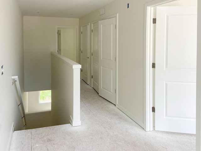 1968 S Shorewood Ln, Holland, MI 49423 - hallway with an upstairs landing and light colored carpet