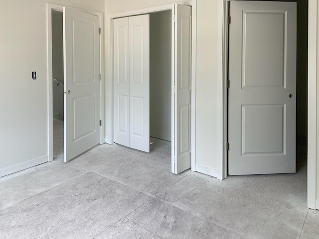1968 S Shorewood Ln, Holland, MI 49423 - unfurnished bedroom featuring a closet and light colored carpet