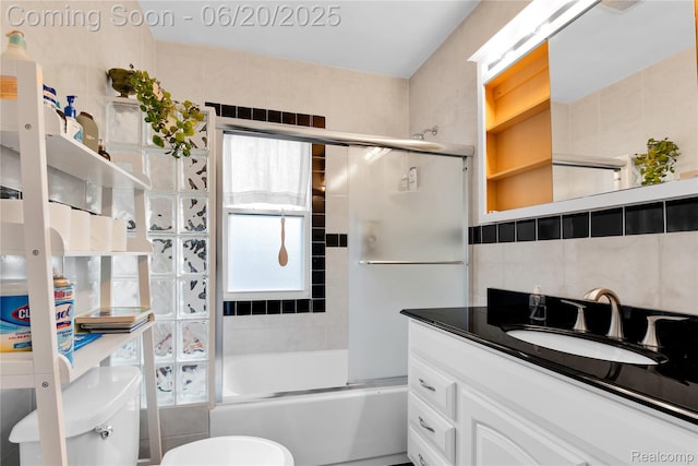 2429 Holmes St, Hamtramck, MI 48212 - full bathroom with vanity, shower / bath combination with glass door, and tasteful backsplash