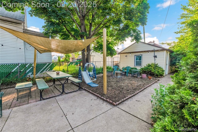 2429 Holmes St, Hamtramck, MI 48212 - view of patio with outdoor dining space and an outdoor structure