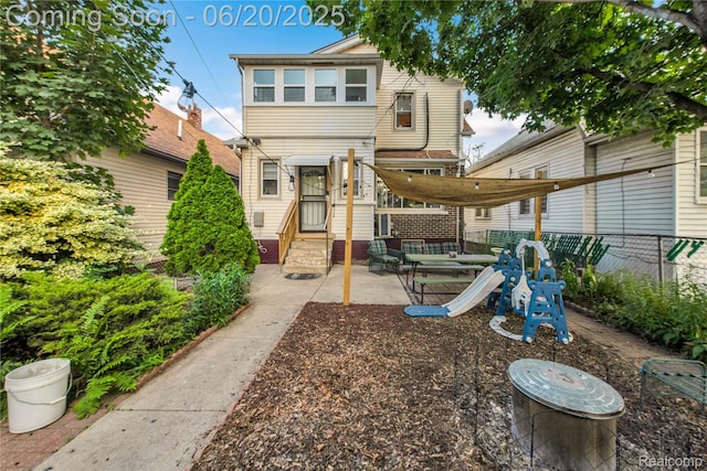 2429 Holmes St, Hamtramck, MI 48212 - back of house featuring a patio area and entry steps