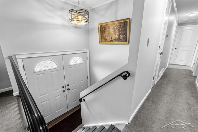 2697 W Olson Rd, Sanford, MI 48657 - foyer entrance with dark carpet and crown molding