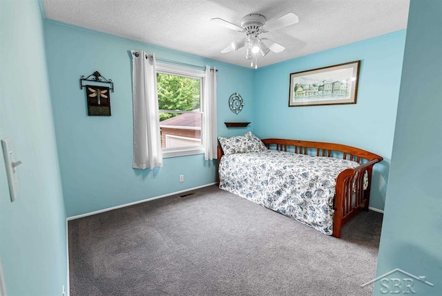 2697 W Olson Rd, Sanford, MI 48657 - carpeted bedroom with a textured ceiling and ceiling fan