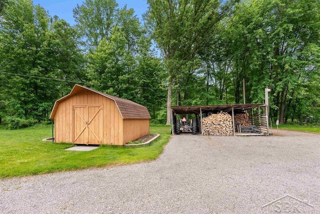 2697 W Olson Rd, Sanford, MI 48657 - view of shed with gravel driveway