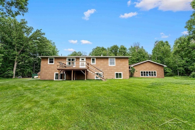2697 W Olson Rd, Sanford, MI 48657 - back of house with stairs, a deck, and a yard