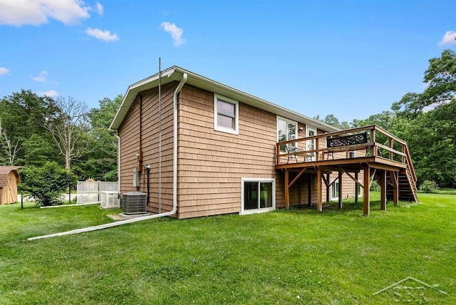 2697 W Olson Rd, Sanford, MI 48657 - rear view of property with stairs, a wooden deck, and a yard