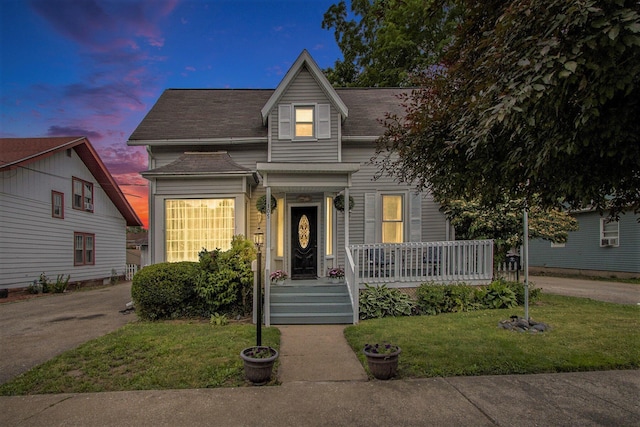 105 Clark St, Buchanan, MI 49107 - view of front of house featuring a front lawn, a porch, and a shingled roof