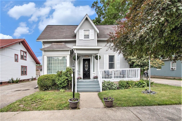 105 Clark St, Buchanan, MI 49107 - view of front facade featuring a front yard and roof with shingles