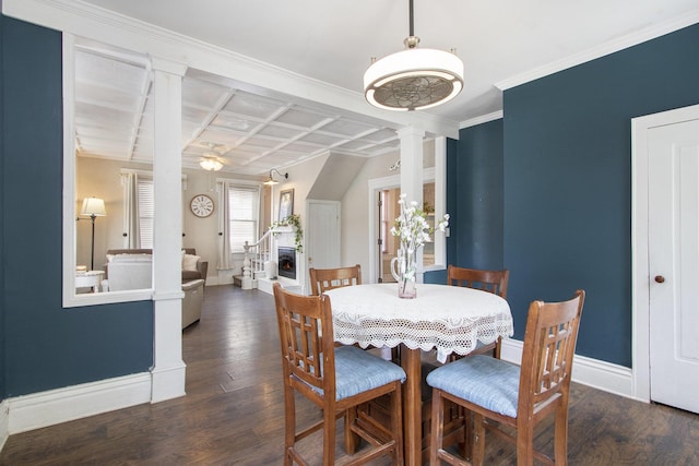 105 Clark St, Buchanan, MI 49107 - dining area featuring decorative columns, coffered ceiling, and wood finished floors