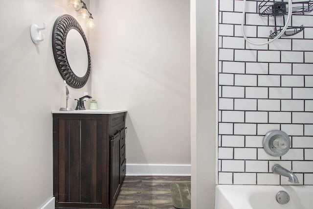 105 Clark St, Buchanan, MI 49107 - bathroom featuring vanity, wood finished floors, and bathtub / shower combination
