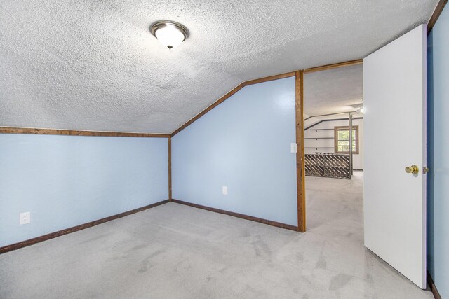 207 E Jefferson St, Cassopolis, MI 49031 - additional living space with a textured ceiling, lofted ceiling, and carpet flooring