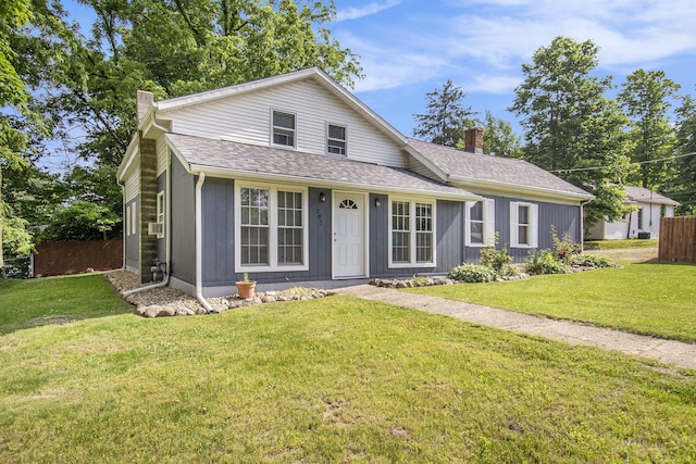207 E Jefferson St, Cassopolis, MI 49031 - view of front of property with a chimney and a shingled roof