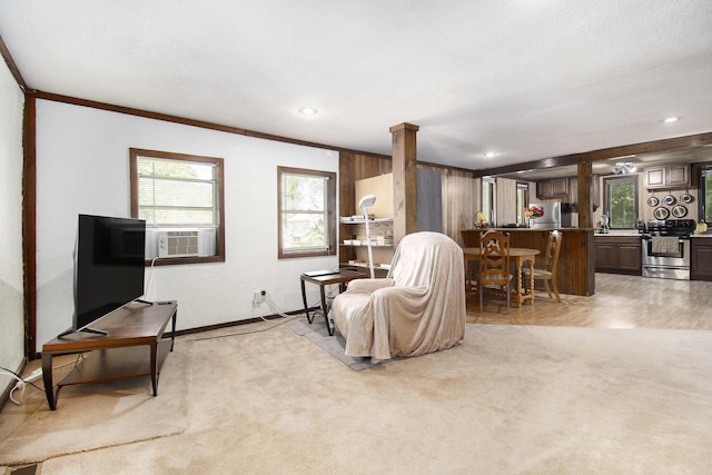 207 E Jefferson St, Cassopolis, MI 49031 - living room featuring cooling unit, healthy amount of natural light, light carpet, and recessed lighting