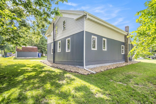 207 E Jefferson St, Cassopolis, MI 49031 - view of property exterior featuring a yard and a shed