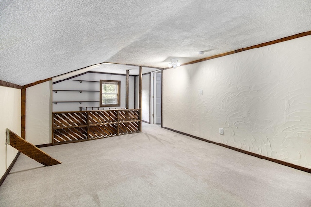 207 E Jefferson St, Cassopolis, MI 49031 - empty room with a textured wall, a textured ceiling, carpet, and lofted ceiling