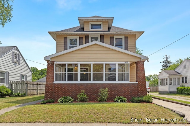 2468 Central Ave SW, Wyoming, MI 49519 - american foursquare style home with brick siding and a sunroom