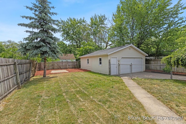 2468 Central Ave SW, Wyoming, MI 49519 - fenced backyard featuring a detached garage and an outbuilding