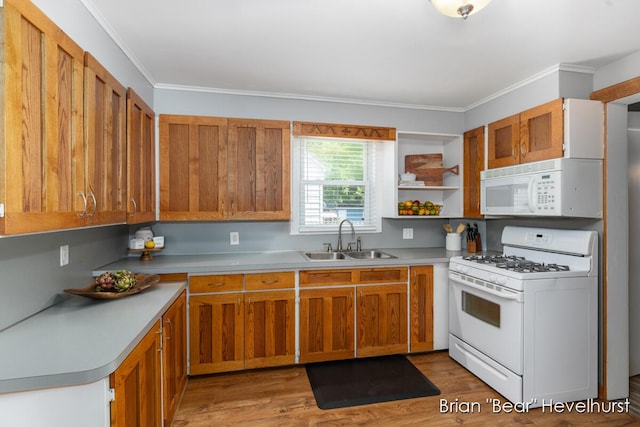 2468 Central Ave SW, Wyoming, MI 49519 - kitchen featuring white appliances, light wood-style flooring, light countertops, brown cabinets, and ornamental molding