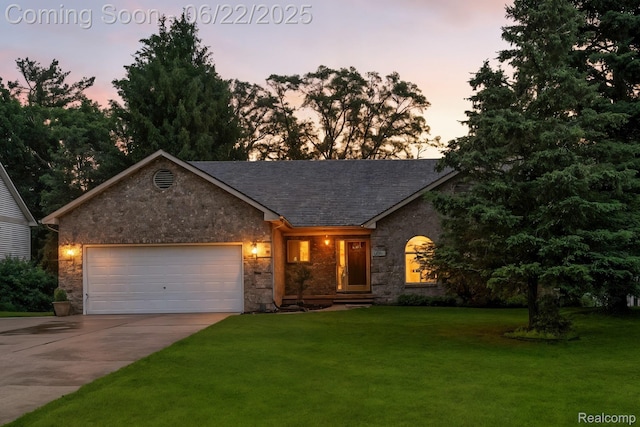 22288 Cass St, Farmington, MI 48335 - view of front facade featuring driveway, an attached garage, a yard, stone siding, and roof with shingles