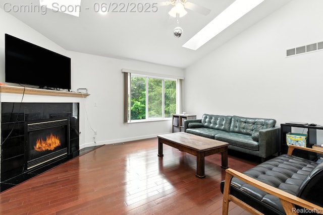 22288 Cass St, Farmington, MI 48335 - living area with a skylight, a ceiling fan, wood finished floors, high vaulted ceiling, and a fireplace