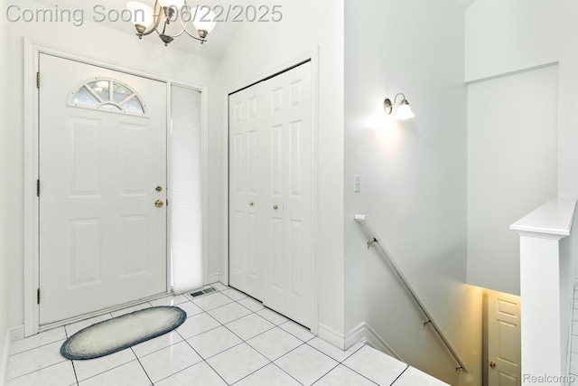 22288 Cass St, Farmington, MI 48335 - entryway featuring a chandelier and light tile patterned floors