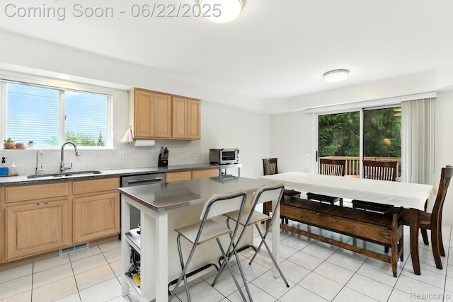 22288 Cass St, Farmington, MI 48335 - kitchen with backsplash, light brown cabinetry, light tile patterned floors, and dark countertops