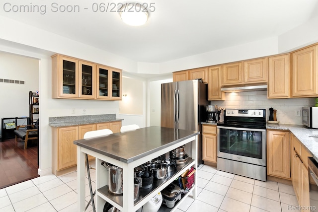 22288 Cass St, Farmington, MI 48335 - kitchen featuring stainless steel appliances, under cabinet range hood, light tile patterned flooring, and light brown cabinetry