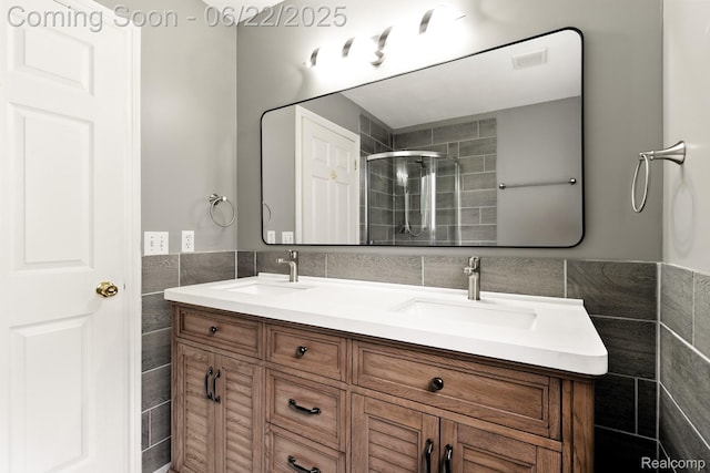 22288 Cass St, Farmington, MI 48335 - full bath featuring tile walls, double vanity, a stall shower, and a wainscoted wall