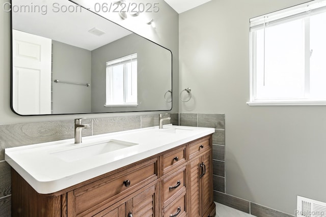 22288 Cass St, Farmington, MI 48335 - bathroom featuring double vanity and tile walls