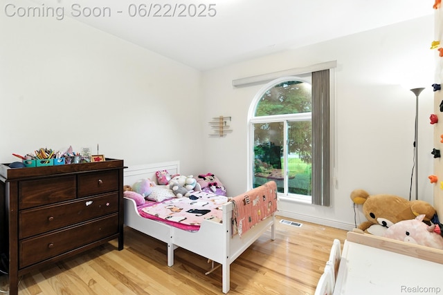 22288 Cass St, Farmington, MI 48335 - bedroom with light wood-style floors and baseboards